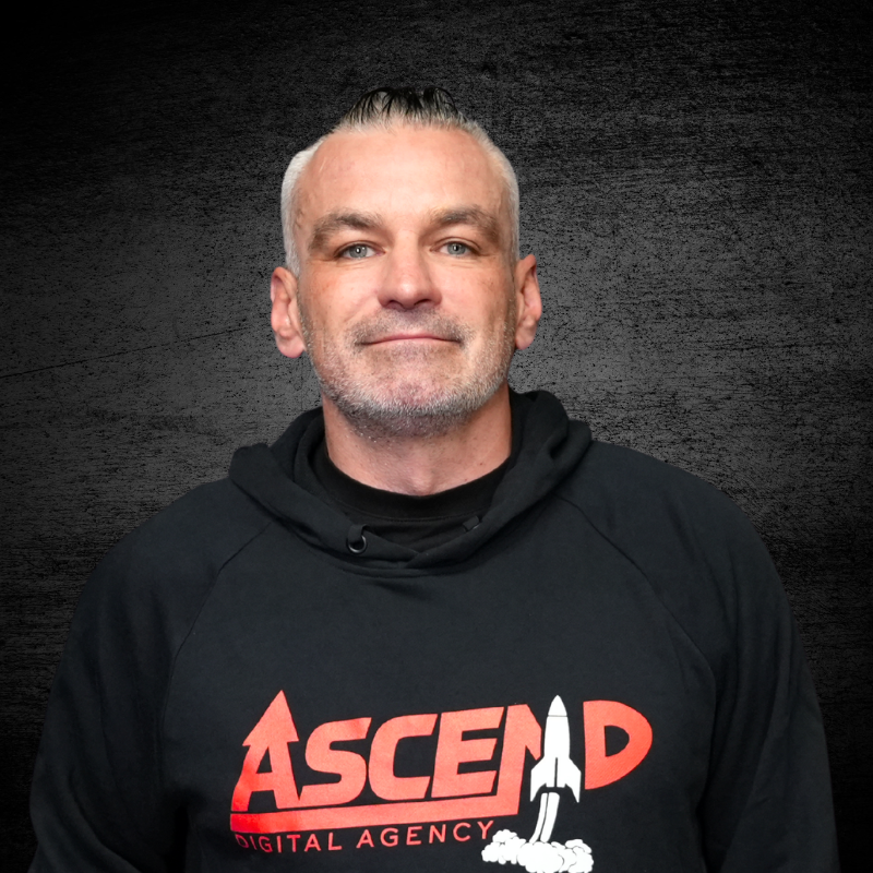 Man wearing Ascend Digital Agency hoodie with a neutral expression