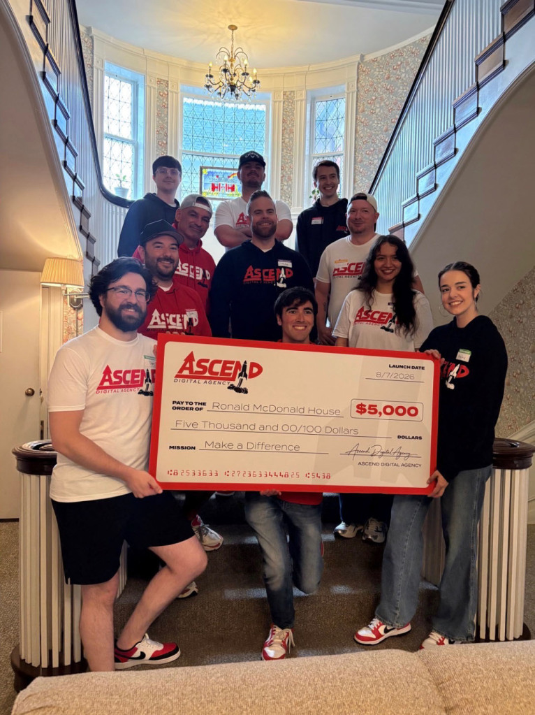 Group from Ascend Digital Agency donating $5,000 to Ronald McDonald House.